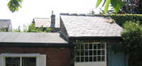 Anew felt roof and reclaimed slate on potting shed